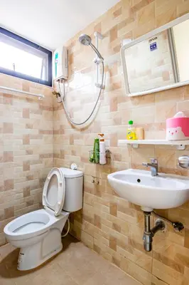 a bathroom with a toilet and a sink at The Cube Sathorn Boutique Hotel เดอะ คิวบ์ สาทร บูติค โฮเทล Near BTS Surasak in Bangkok