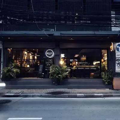 a store front of a restaurant at night at Heyyyy Bangkok in Bangkok