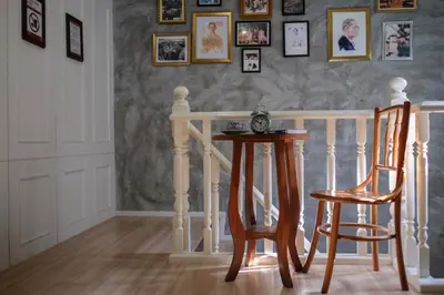 a dining room with a table and two chairs at Ratana Boutique Hostel in Bangkok