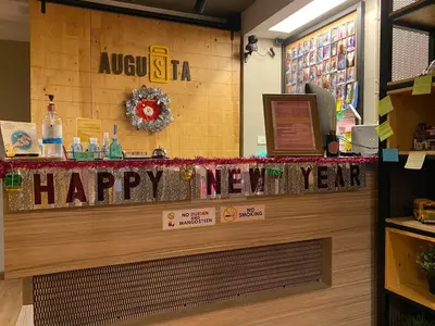 a happy new year sign on a counter in a store at Augusta in Bangkok