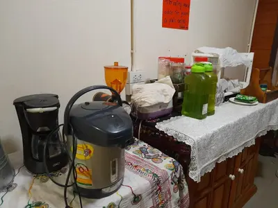 a kitchen with a table with a coffee maker on it at Indy house59 in Bangkok