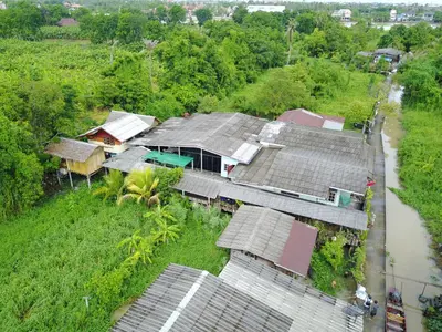 an overhead view of a house and a river at Cast Away in Nonthaburi