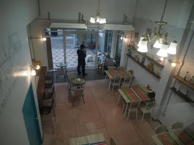 an overhead view of a restaurant with tables and chairs at Sriyanar Place in Bangkok
