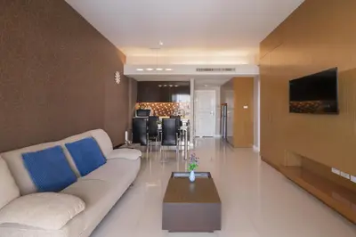 a living room with a couch and a table at At 115 Hotel By Rompo in Bangkok
