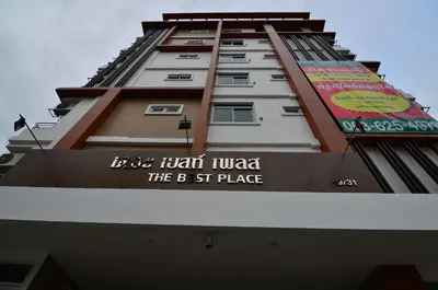 a tall building with a sign on the side of it at The Best Place in Samutprakarn