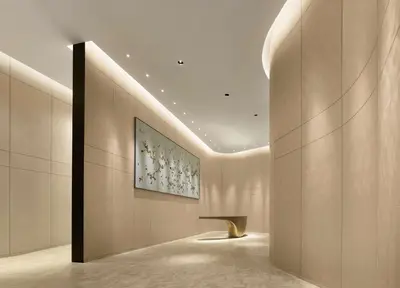 a lobby with a wall with a painting on it at Park Hyatt Bangkok in Bangkok