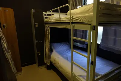 a couple of bunk beds in a room at Mahannop Hostel in Bangkok
