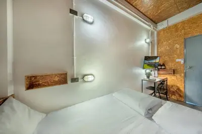 a bedroom with a white bed in a room at RALPH Bangkok in Bangkok