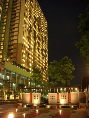 a tall building at night with lights in a city at Bangkok view in Pinklao in Bangkok