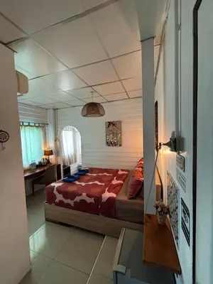 a bedroom with a large bed in a room at La Locanda in Bangkok