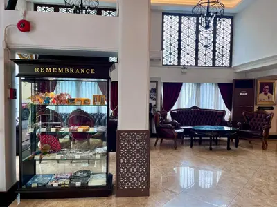 a room with a glass display case in a building at Siam Champs Elyseesi Unique Hotel in Bangkok