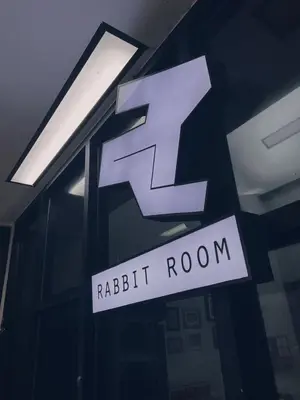 a sign for a ritz room in a building at Rabbit Room in Bangkok