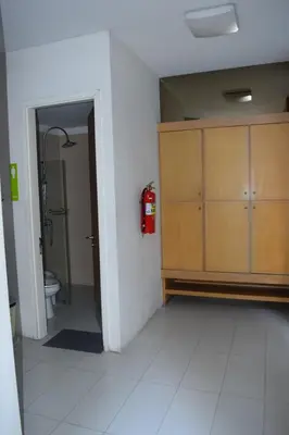 a bathroom with a fire hydrant next to a room with a fire hydrant at Studio in Haven in Bangkok