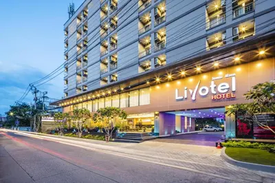 a building with a hotel sign on the side of it at Livotel Hotel Hua Mak Bangkok in Bangkok