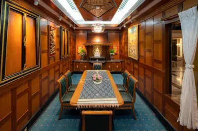 a dining room with a table and chairs at Alexander Hotel in Bangkok