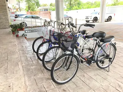 a group of bikes parked next to each other at Anna-Nava Pakkret Hotel in Nonthaburi