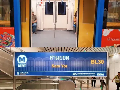 a subway train door is open with people inside at Issara by D Hostel in Bangkok