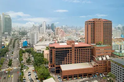 an aerial view of a city with tall buildings at The Emerald Hotel in Bangkok