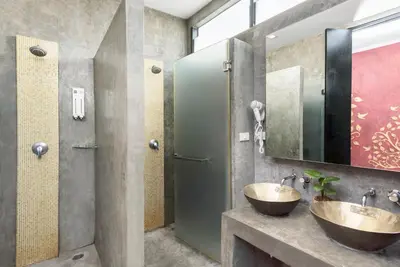 a bathroom with two sinks and a mirror at Nappark Hostel @Khao San in Bangkok