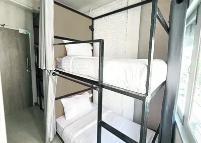 a couple of bunk beds in a room at Nappark Hostel @Khao San in Bangkok