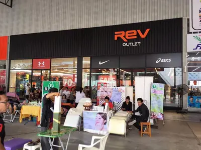a group of people standing outside of a furniture store at Condo Muang Thong in Nonthaburi