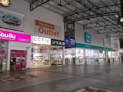 a store with many signs in a building at Condo Muang Thong in Nonthaburi