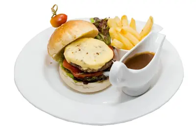 a plate of food with a sandwich and french fries at New Siam Palace Ville Hotel in Bangkok