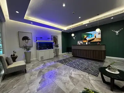 a lobby with a fish tank in a room at The Legacy Hotel Nana Sukhumvit, Aspira Collection in Bangkok
