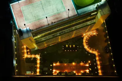 an overhead view of a building with lights at night at Marriott Executive Apartments Sukhumvit Park, Bangkok in Bangkok
