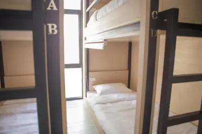 a couple of bunk beds in a room at Le Bonheur Poshtel in Bangkok