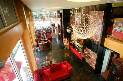 an overhead view of a living room with a red couch at Sabai Sabai@Sukhumvit Hotel in Bangkok