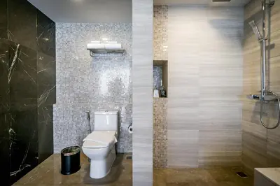 a bathroom with a toilet and a shower at Onix Hotel Bangkok in Bangkok