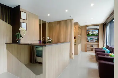 a kitchen and living room with a bar in a bus at SiRi Ratchada Bangkok in Bangkok