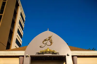 a sign on top of a building at Mida Hotel Don Mueang Airport in Bangkok