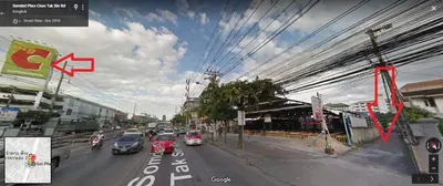 a view of a city street with cars on the road at Anurak Guesthouse in Bangkok