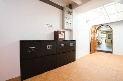 a room with a row of lockers in a building at House of Happiness in Bangkok