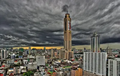 a view of a city with a tall building at Cozi Inn Hotel, Bangkok in Bangkok