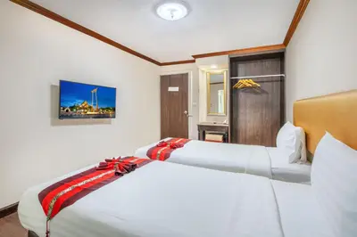 two beds in a hotel room with at NASA BANGKOK - Airport Rail Link Ramkhamhang in Bangkok