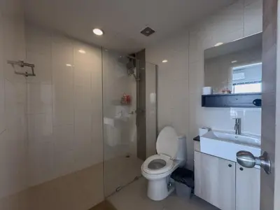 a bathroom with a toilet and a shower and a sink at Nice view over the heart of Bangkok in Bangkok