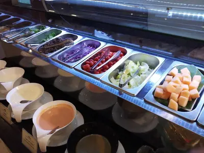 a tray of food with different fruits and vegetables at The Maruay Garden Hotel in Bangkok