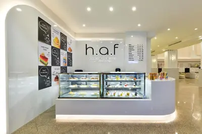 a bakery with a display case filled with pastries at Twin Towers Hotel in Bangkok