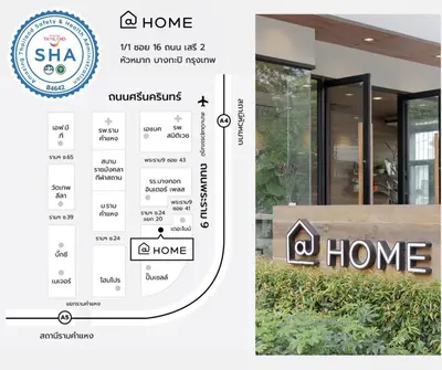 a home sign and a picture of a house at @Home Residence in Bangkok