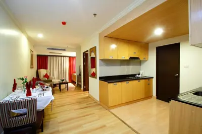 a kitchen and living room with a table in a room at Princeton Bangkok in Bangkok