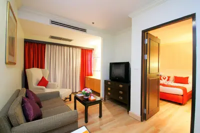 a living room with a couch and a bed at Princeton Bangkok in Bangkok