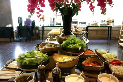 a table topped with lots of different types of food at Night Hotel Bangkok - Sukhumvit 15 in Bangkok