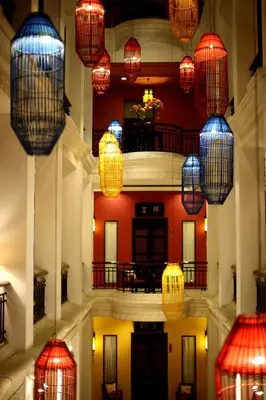 a building with chinese lanterns hanging from the ceiling at Shanghai Mansion Bangkok in Bangkok