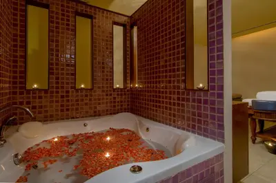 a bath tub filled with lots of debris in a bathroom at The Sukosol Hotel in Bangkok