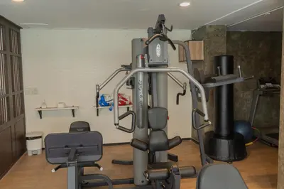 a room with a gym with some equipment in it at Forum Park Hotel in Bangkok