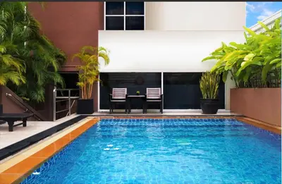a swimming pool in the middle of a house at FuramaXclusive Sukhumvit in Bangkok