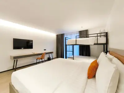 a hotel room with a bed and a desk at Citichic Sukhumvit 13 by Compass Hospitality - Newly Renovated in Bangkok